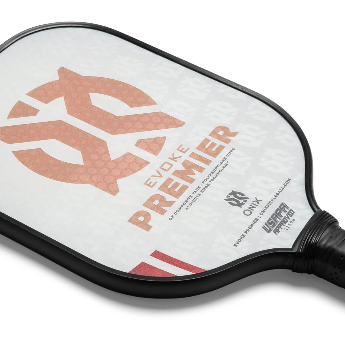 Corner view of a white pickleball paddle with a large peach logo, PREMIER text, and USAPA approved stamp.