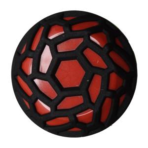Top-down view of a black and red softball with a honeycomb pattern.