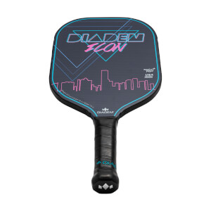 Front view of a dark gray pickleball paddle with DIADEM ICON text, a cityscape graphic, and a black grip.