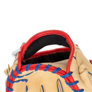 Close-up view of the top of a tan baseball glove, showing red binding and blue lacing.