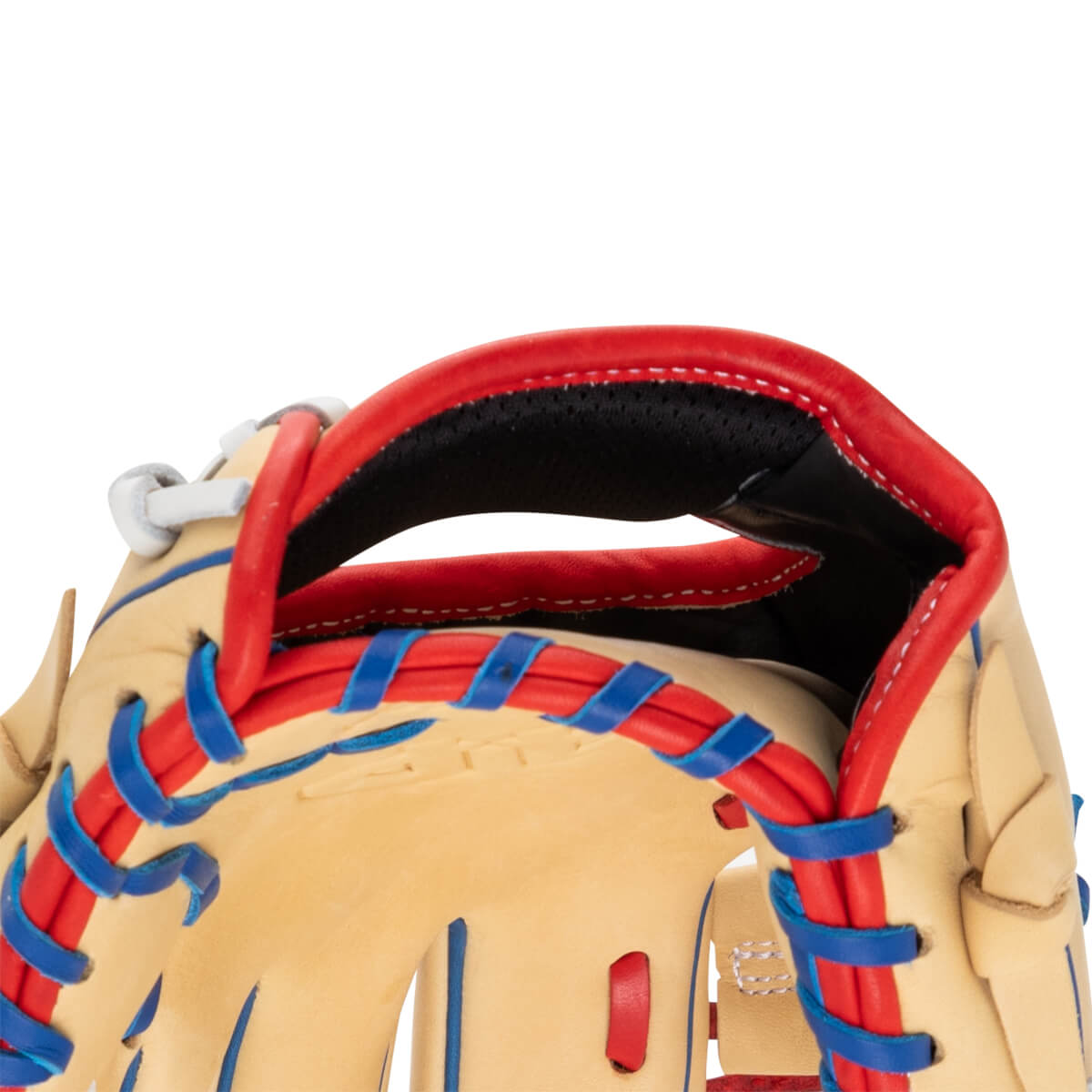 Close-up view of the heel of a tan leather baseball glove with red lacing and a black interior.
