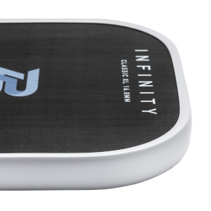 Corner view of a black pickleball paddle with white edge, INFINITY text, and CLASSIC XL 16.0MM text.