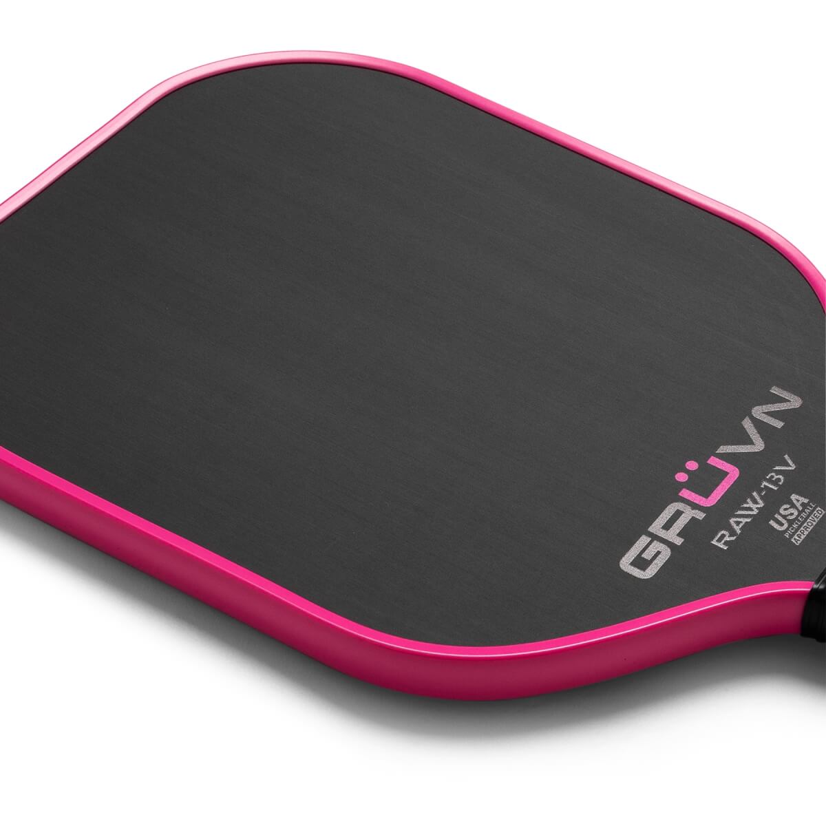 Close-up of a pink pickleball paddle with GRUVN RAW-13V USA Pickleball Approved branding.