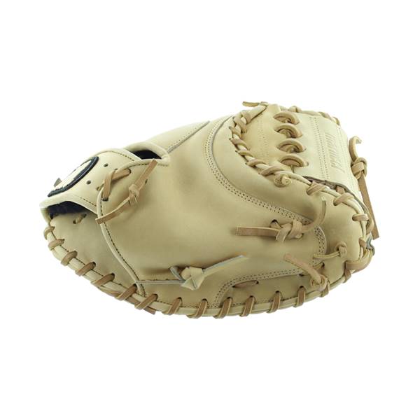 Side view of a tan catchers mitt with tan lacing and a black patch.