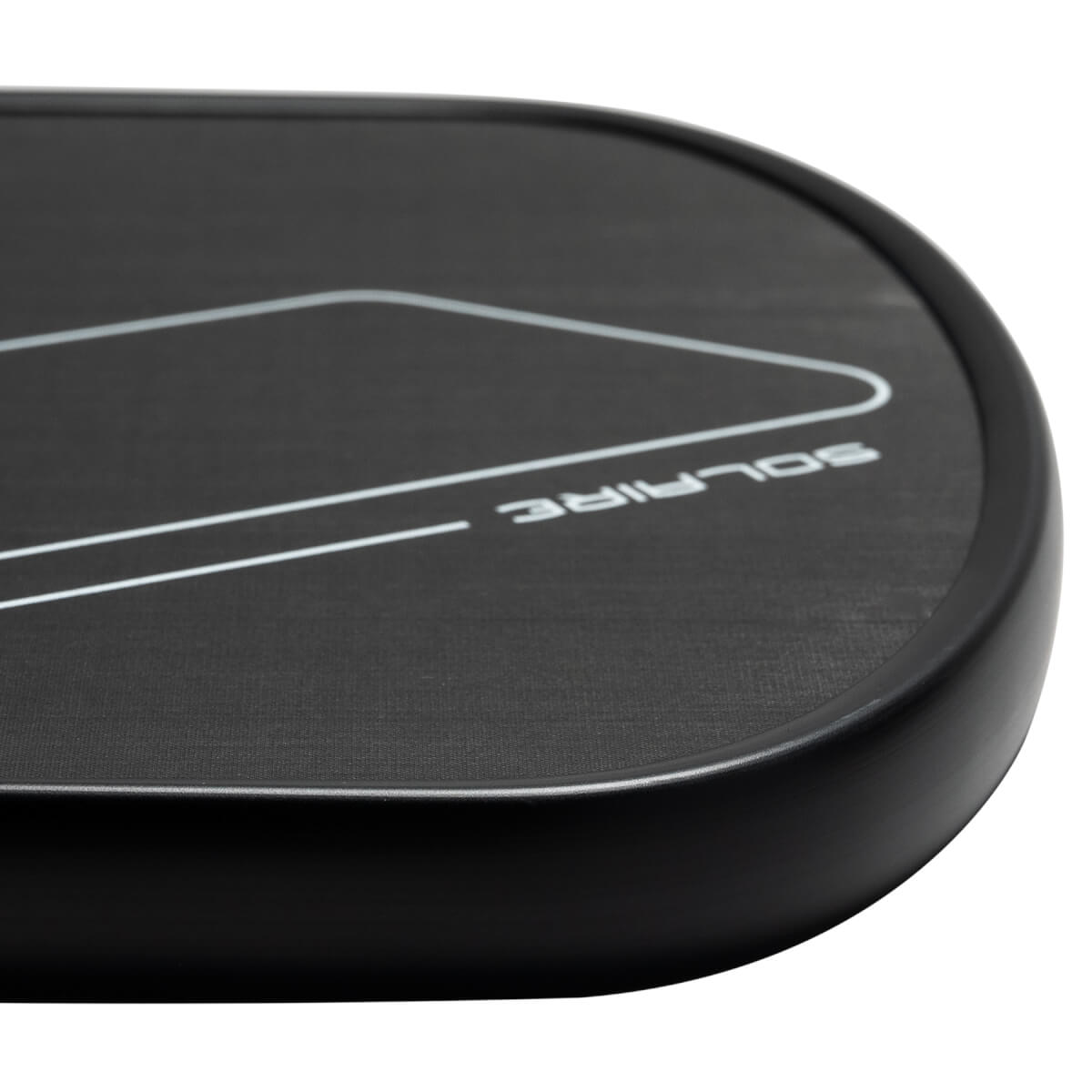 Corner view of a black pickleball paddle with white SOLAIRE text and a geometric design.