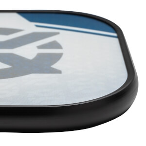 Corner view of a white pickleball paddle with blue and gray graphic accents and a black edge.