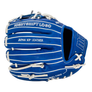 Back view of a blue baseball glove with white laces and welting lines, featuring the white text "NIGHTSHIFT LOGO," "JAPAN KIP LEATHER," "WELTING," and an "ma" logo.
