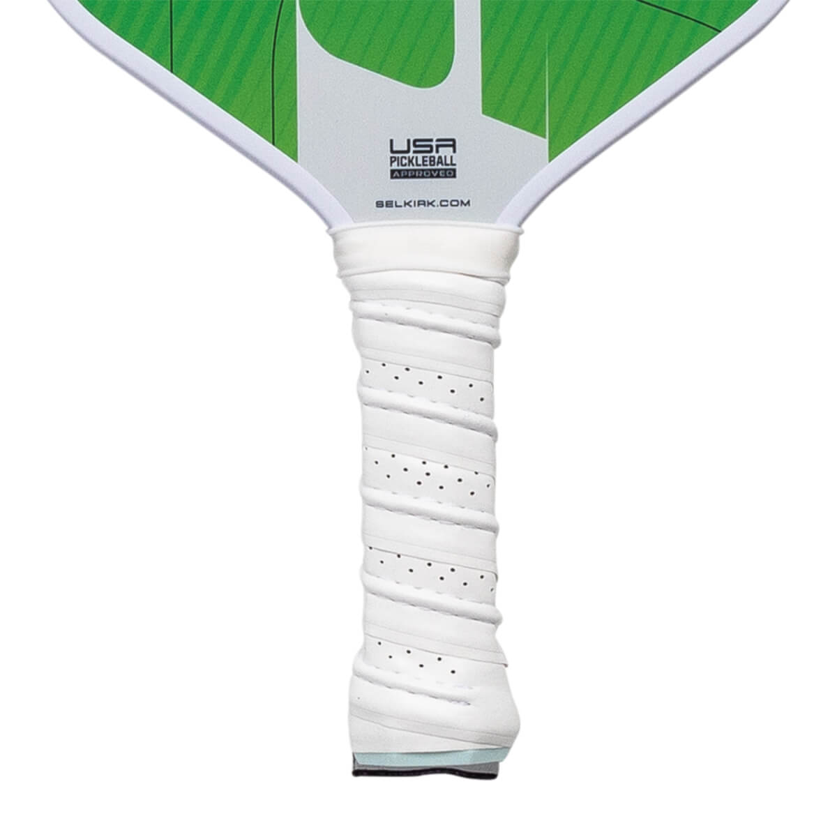 Close-up of a white pickleball paddle grip with perforated texture and USA Pickleball Approved logo.
