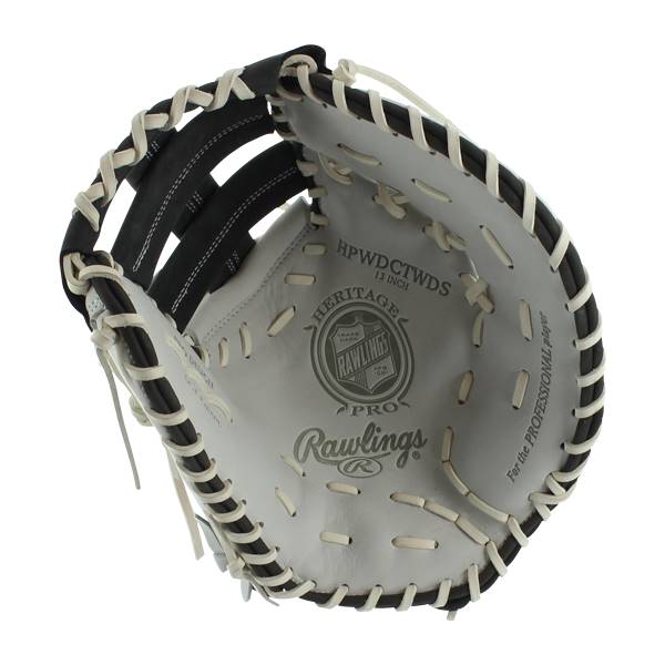 Top-down view of a white Rawlings Heritage Pro 13 first base mitt with black lacing and For the Professional player text.