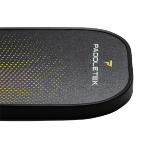 Corner view of a black pickleball paddle with a yellow dotted gradient and PADDLETEK text.