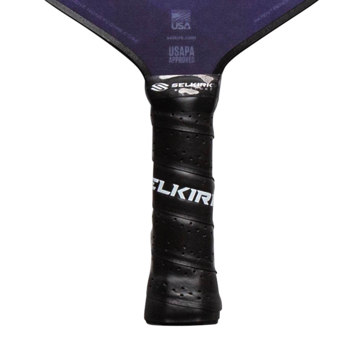 Close-up of a black pickleball paddle grip with white SELKIRK text and USAPA approved logo.