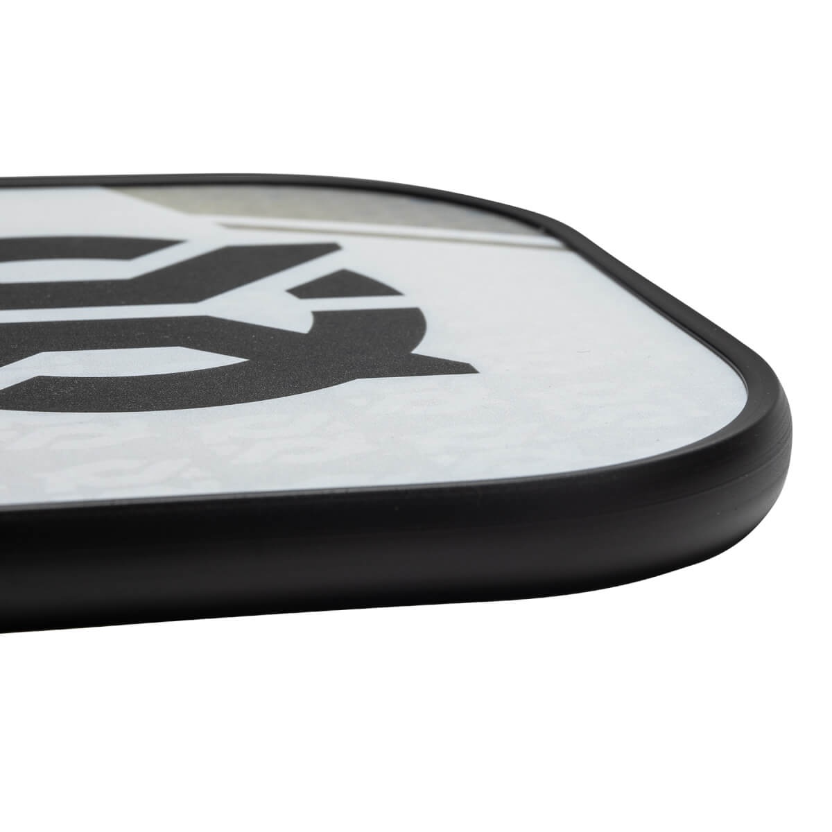 Corner view of a white pickleball paddle with a black border and a large black graphic.