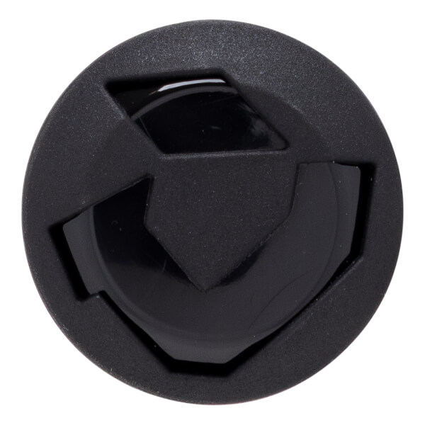 Top-down view of a circular black cap featuring a matte textured outer rim and a stylized geometric shield logo in the center against a glossy background.
