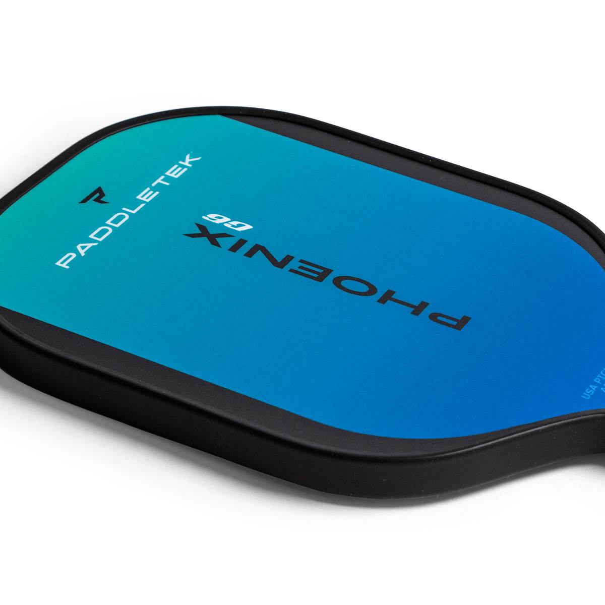 Corner view of a blue and green pickleball paddle with Paddletek and Phoenix G6 branding.