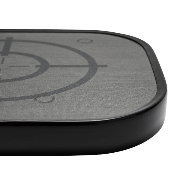 Corner view of a gray pickleball paddle with a black edge and target graphic.