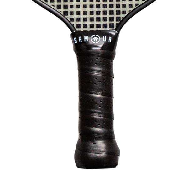 Close-up of a black pickleball paddle grip with ARMOUR text and a perforated surface.