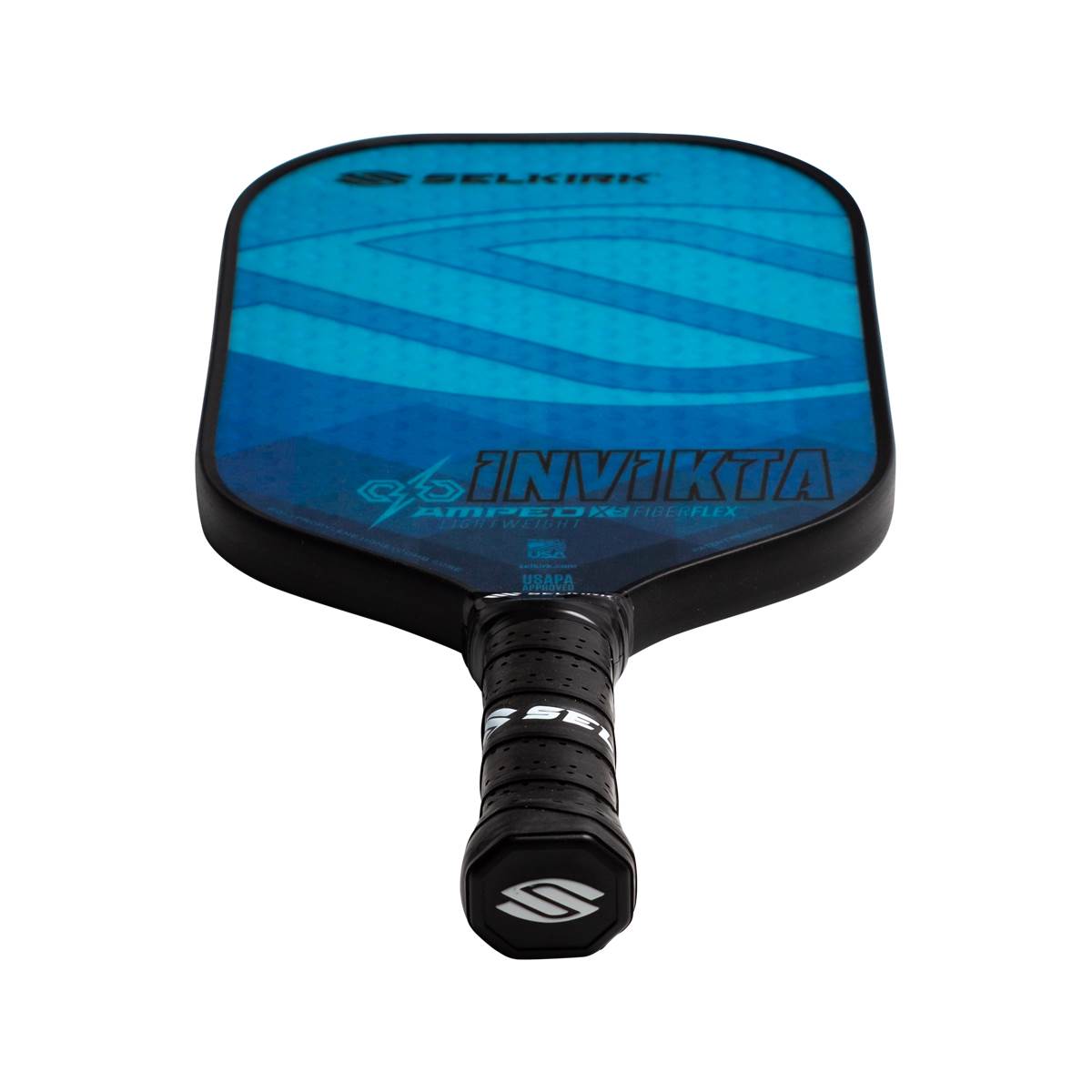 Top-down view of a blue Selkirk AMPED Invikta pickleball paddle with a black grip and white S logo.