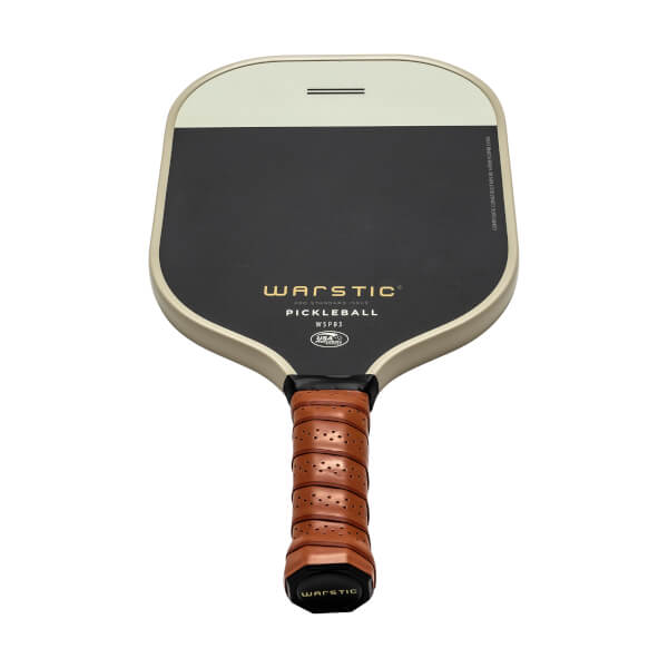 Front view of a black and cream pickleball paddle with WARSTIC PICKLEBALL text and a brown perforated grip.