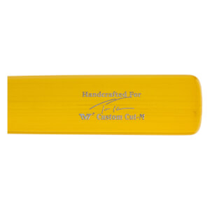 Close-up of a yellow baseball bat with Handcrafted For text, a signature, and W7 Custom Cut-M inscription.