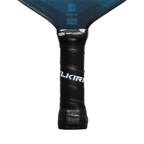 Close-up of a black pickleball paddle grip with SELKIRK branding and perforations.