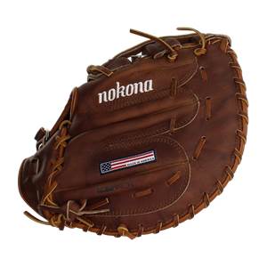 Front view of a brown baseball glove with nokona branding and a Made in America patch.