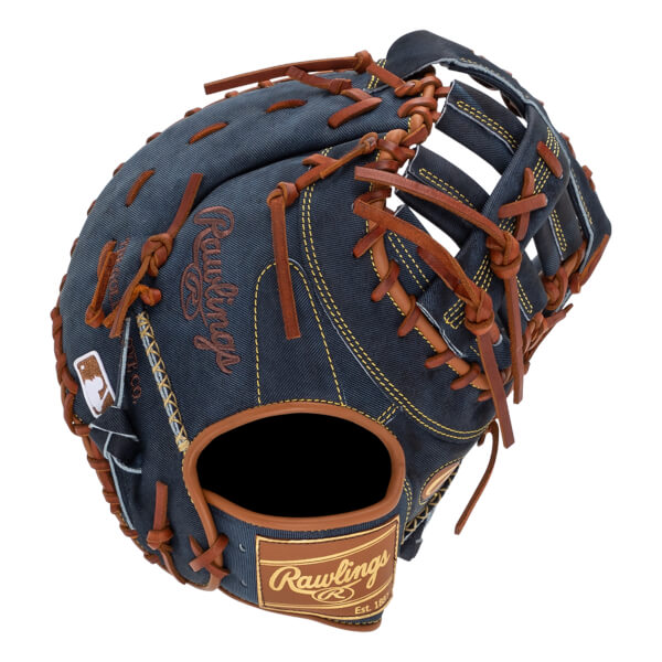 Top-down view of a blue denim baseball glove with brown lacing and Rawlings branding.