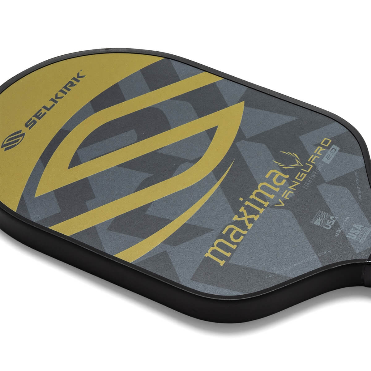 Corner view of a gray and gold pickleball paddle with a geometric pattern and Selkirk logo.