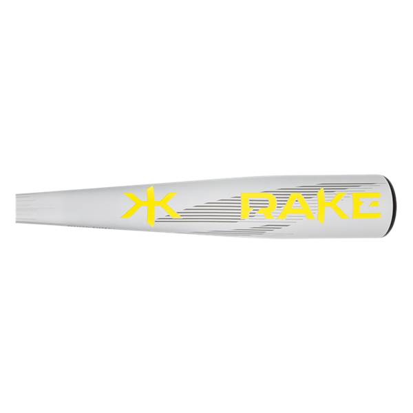Side view of a light gray baseball bat with prominent yellow RAKE text, a yellow logo, and fine gray horizontal lines.