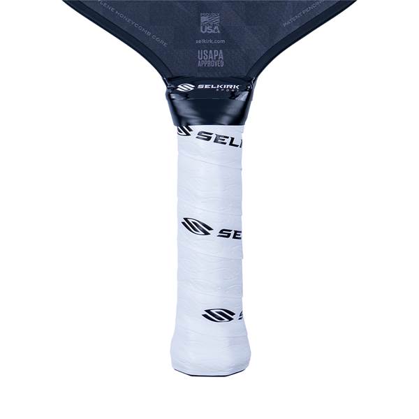 Close-up of a white pickleball paddle grip with black Selkirk branding and USAPA approved text.