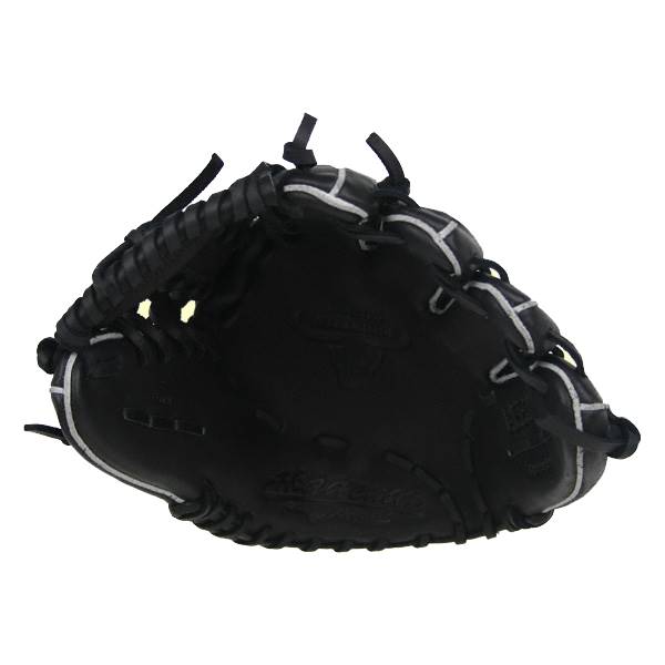 Top-down view of a black baseball glove with white stitching and Akadema text.