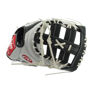 Side view of a white and black first base mitt with red Rawlings branding and white lacing.