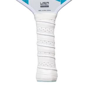 Close-up of a white pickleball paddle grip with perforated texture and USA Pickleball Approved logo.