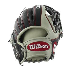 Side view of a tan and black baseball glove with red trim and a Wilson logo.