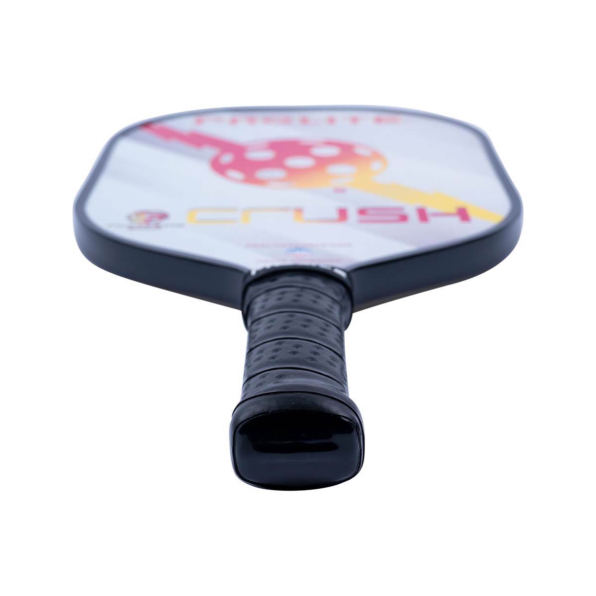 Bottom view of a white pickleball paddle with a black grip and red and yellow CRUSH text.