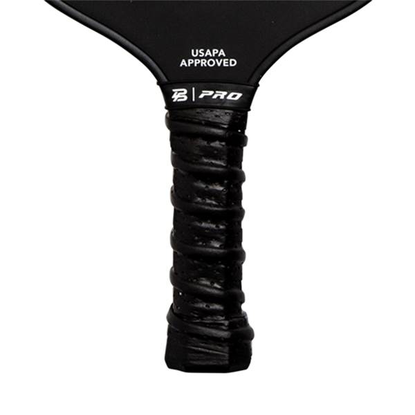 Close-up of a black pickleball paddle grip with B | PRO logo and USAPA APPROVED text.