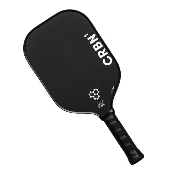 Top-down view of a black pickleball paddle with CRBN¹ branding, a honeycomb logo, and USA text.