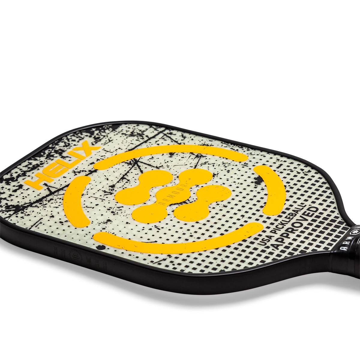 Close-up of a white pickleball paddle with yellow helix design and USA PICKLEBALL APPROVED text.