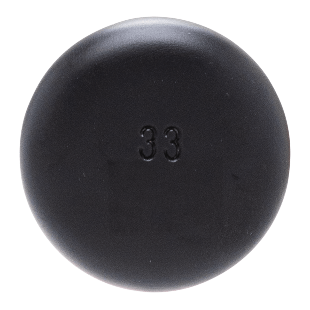 Top-down view of a round black object with the number "33" embossed in the center.