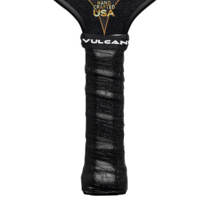 Close-up of a black pickleball paddle grip with Vulcan branding and HAND CRAFTED USA text.