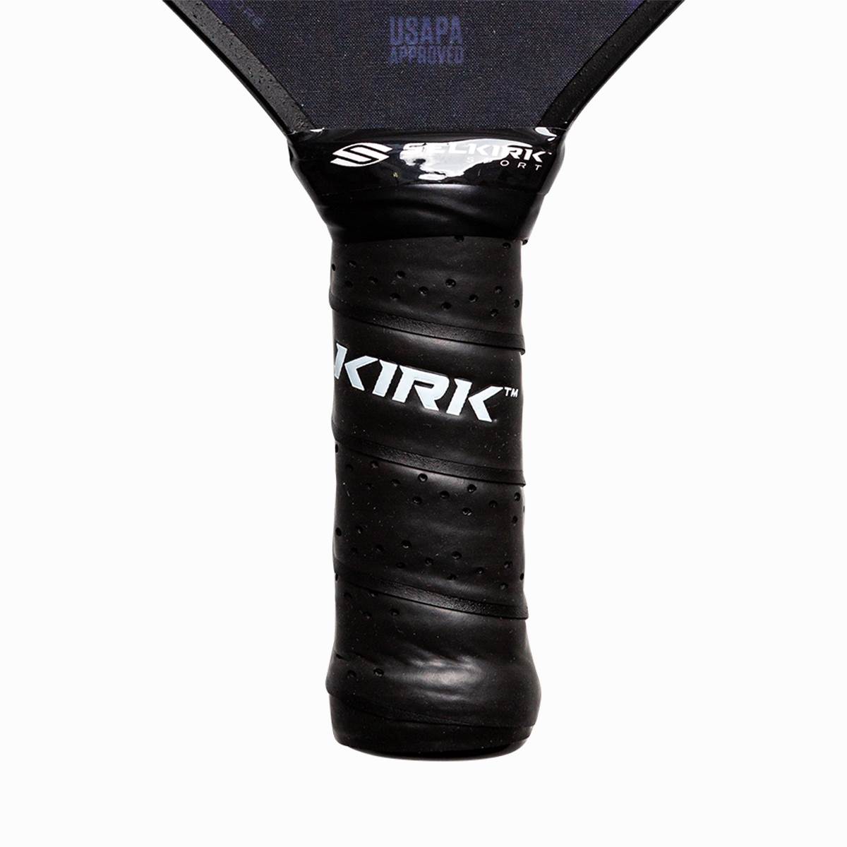 Close-up of a black pickleball paddle grip with KIRK branding and USAPA APPROVED text.