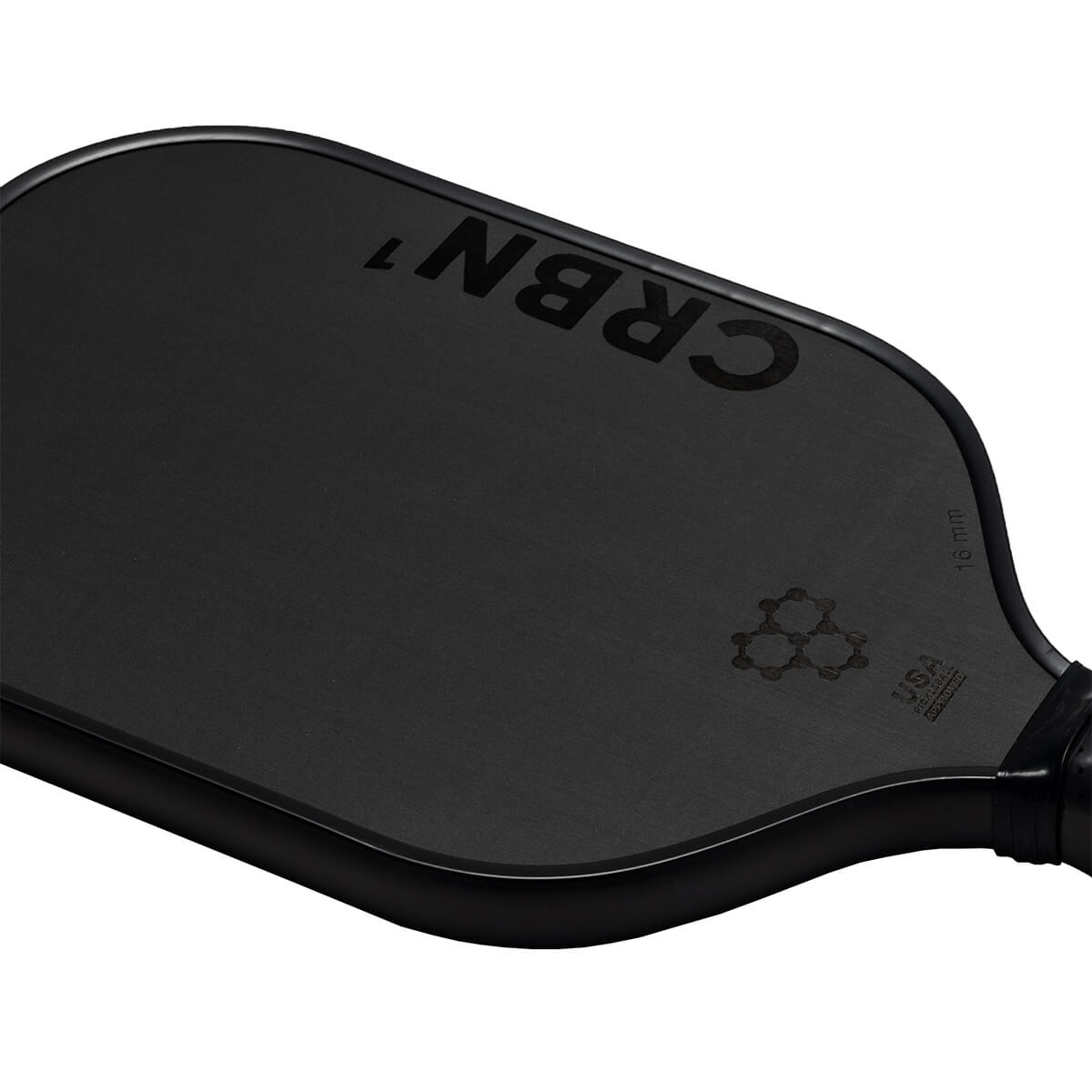 Corner view of a black pickleball paddle with CRBN 1 branding and a USA Pickleball logo.