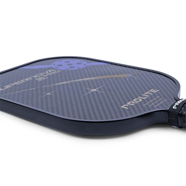 Corner view of a black pickleball paddle with carbon fiber texture and PROLITE branding.
