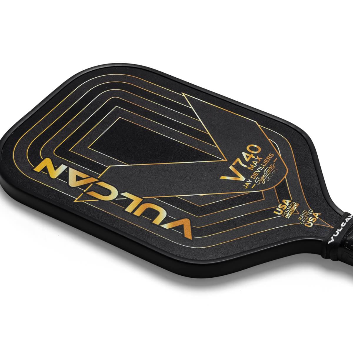 Top-down view of a black Vulcan V740 Max pickleball paddle with gold geometric lines and V740 Max branding.