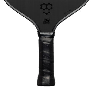 Top-down view of a black pickleball paddle with a honeycomb logo, USA PICKLEBALL APPROVED text, and 16 mm marking.
