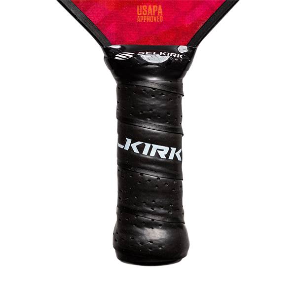 Close-up of a black pickleball paddle grip with KIRK branding and perforated texture.