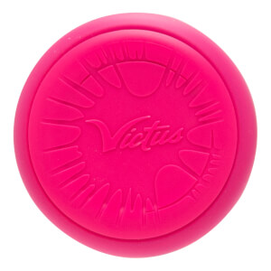 Top-down view of a bright pink baseball bat end cap with an embossed Victus logo and radial textured pattern.
