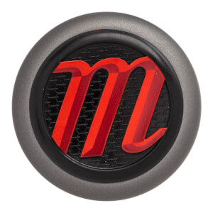 Top-down view of a gray baseball bat end cap with a red m logo on a black textured background.