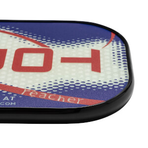 Corner view of a white pickleball paddle with red and blue graphics, showing reacher text.