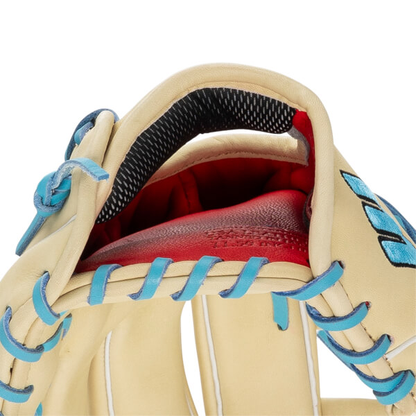 Close-up of a tan baseball glove with red padding, black mesh lining, and light blue lacing.