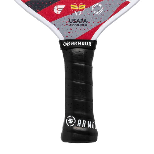 Top-down view of a black pickleball paddle grip with Armour branding and USAPA approved text.